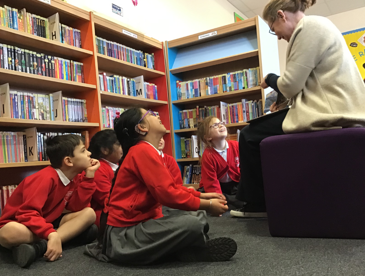 Children listening to a story in the library.