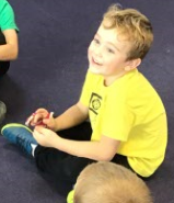 Service child participating in circle time