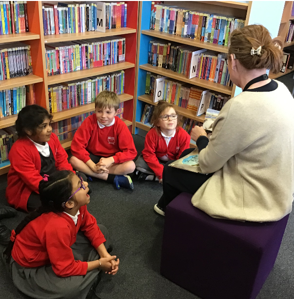 Children enjoying a story in the library. 