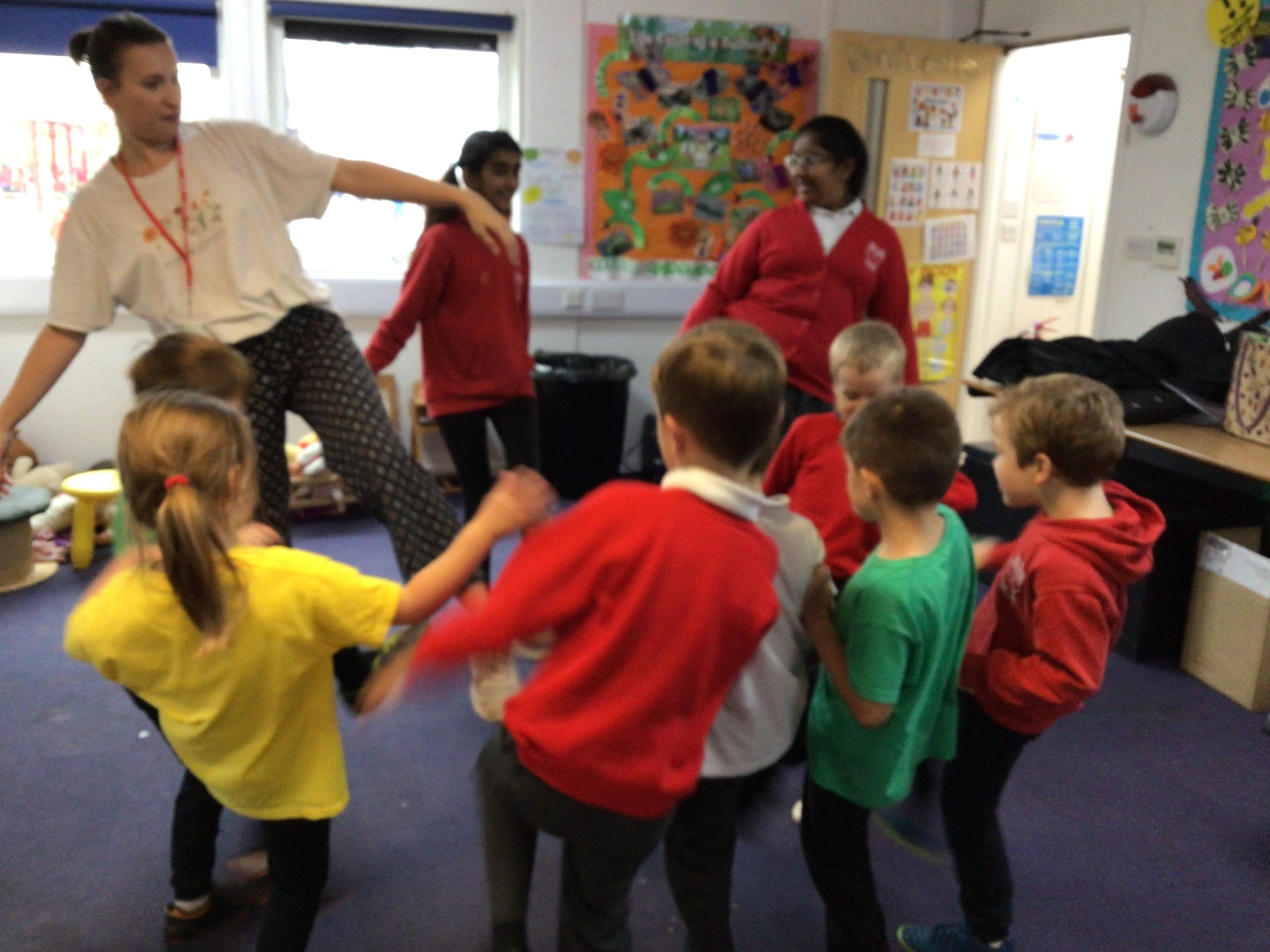 Equal Arts Teacher in class with children