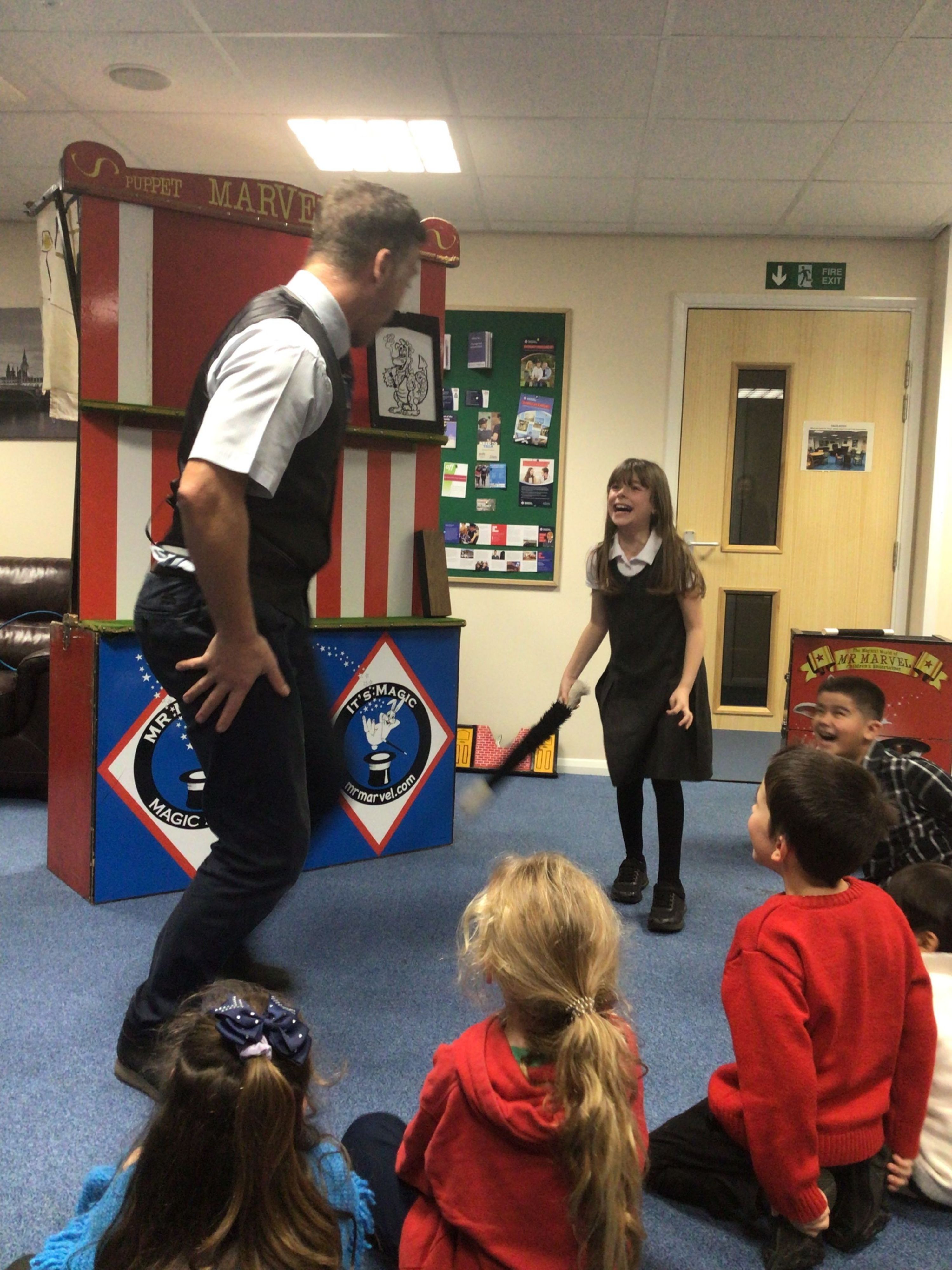 Service children at a magic show