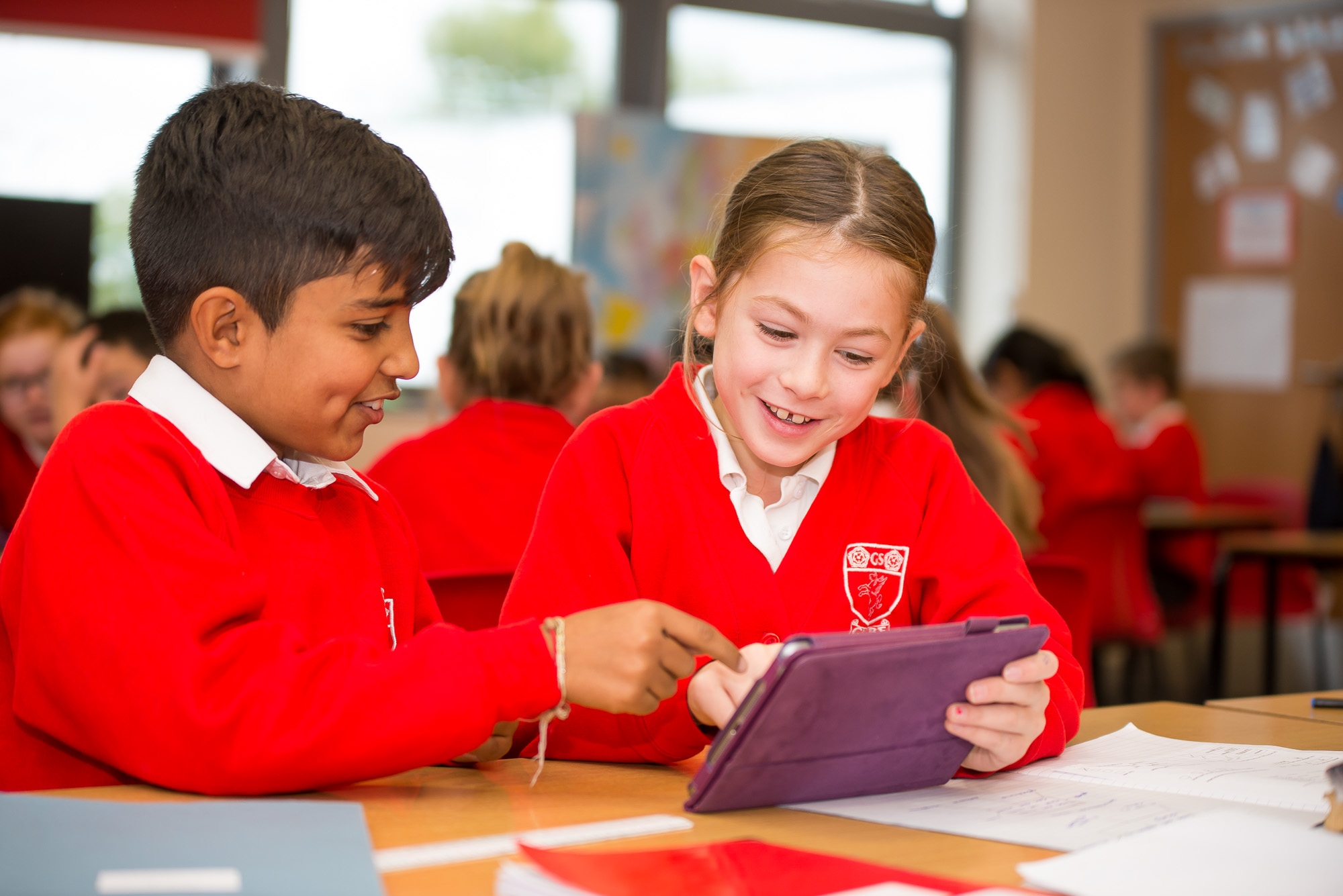 Children looking at Ipad