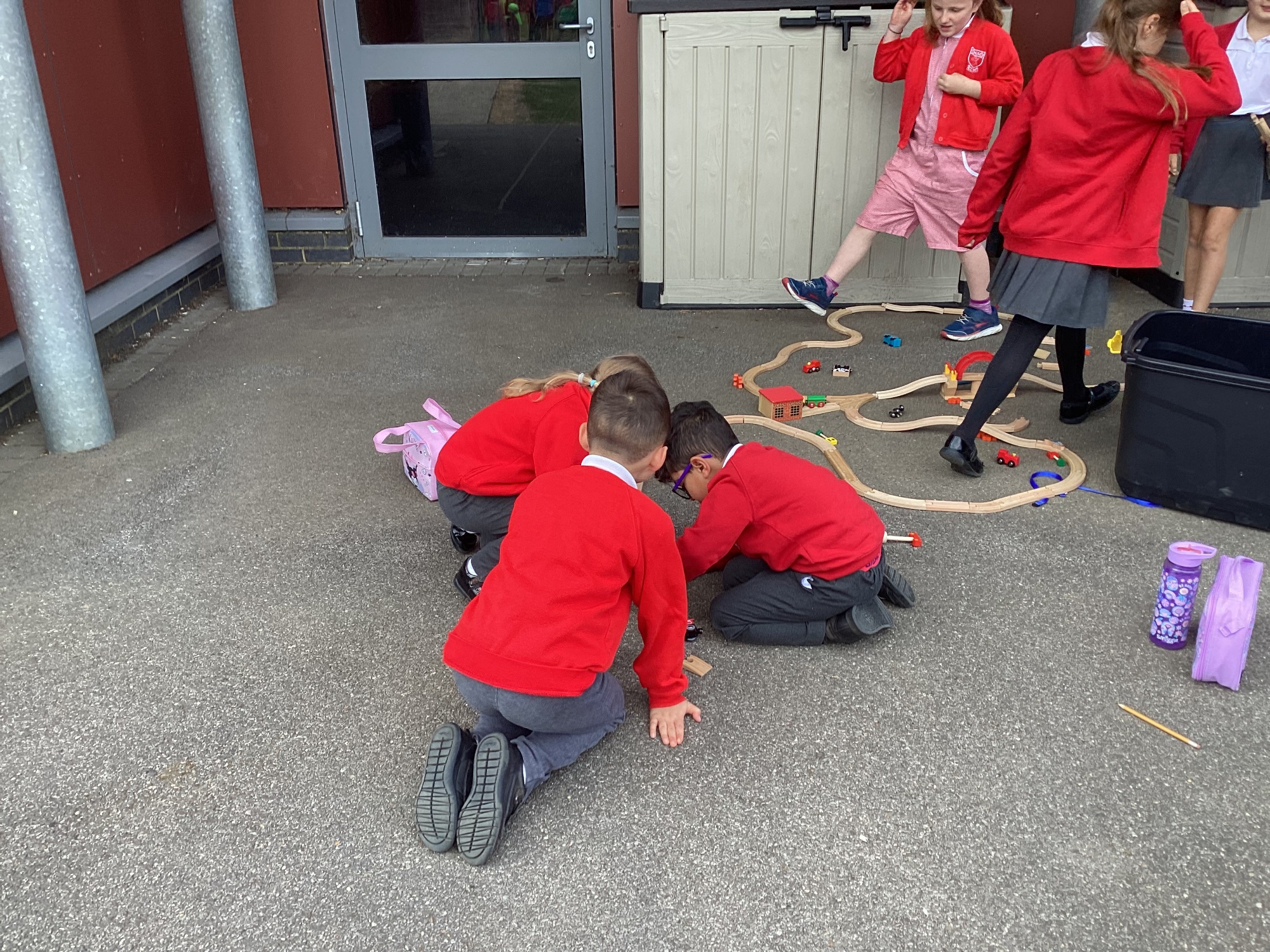 Children using chalk on the playground