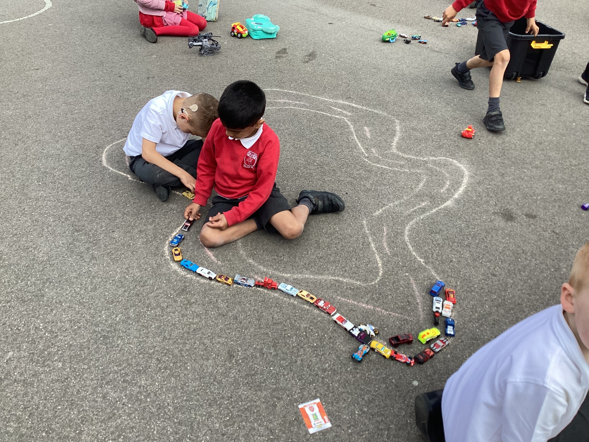 Children using chalk on the playground